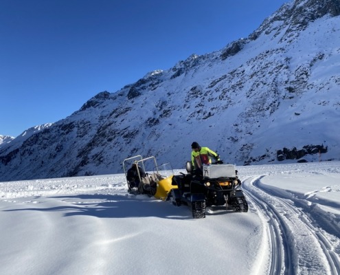 a person on a snowmobile in the snow