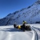 a person on a snowmobile in the snow