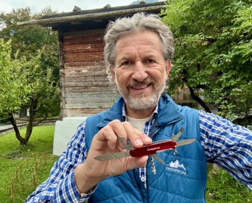 Person holding a Swiss army knife.